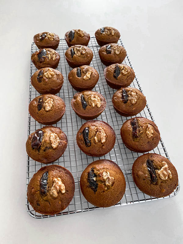 The muffins are now out of the tray and are resting on a wire cooling rack until completely cooled down.