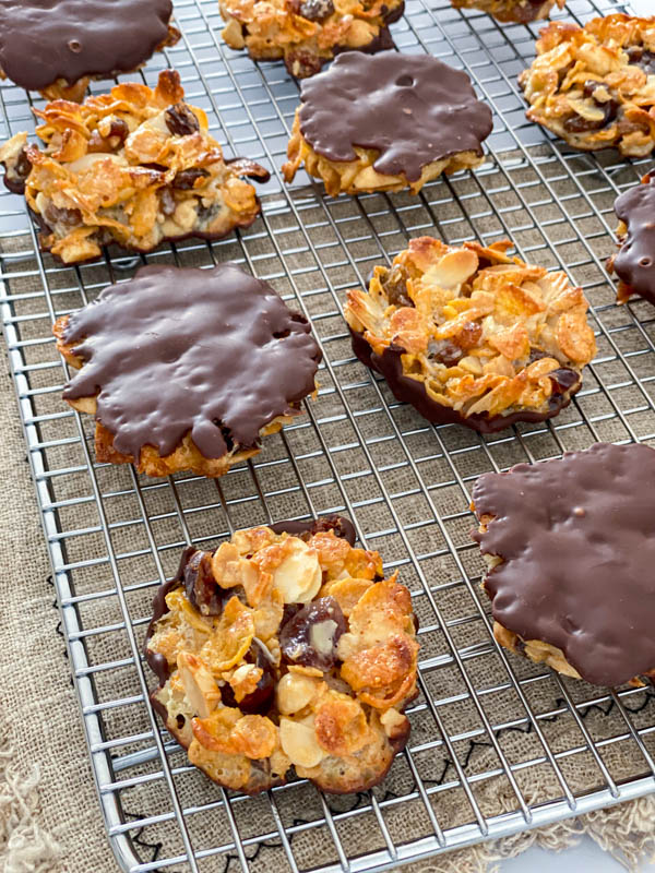 The florentines are resting on a wire cooling rack. The chocolate coating is now set and they are shown here on display with some turned upside down to show both sides of the biscuit.