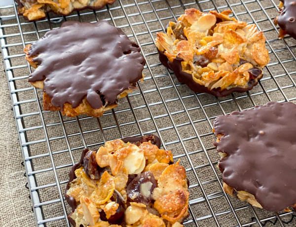 The florentines are ready to be served or stored. They are pictured here on a wire rack with some upside down to show the chocolate bottoms.
