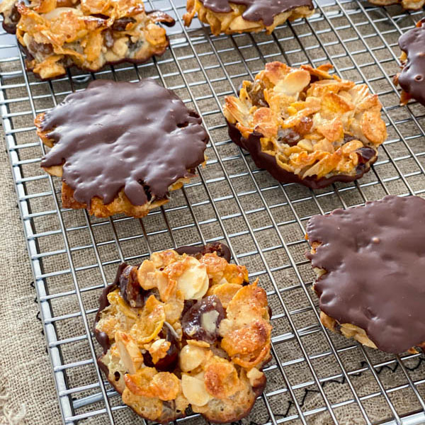 The florentines are ready to be served or stored. They are pictured here on a wire rack with some upside down to show the chocolate bottoms.