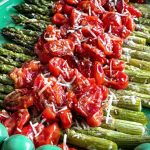 A close up of the Roasted Asparagus and Tomato Salad on a plate ready for serving.