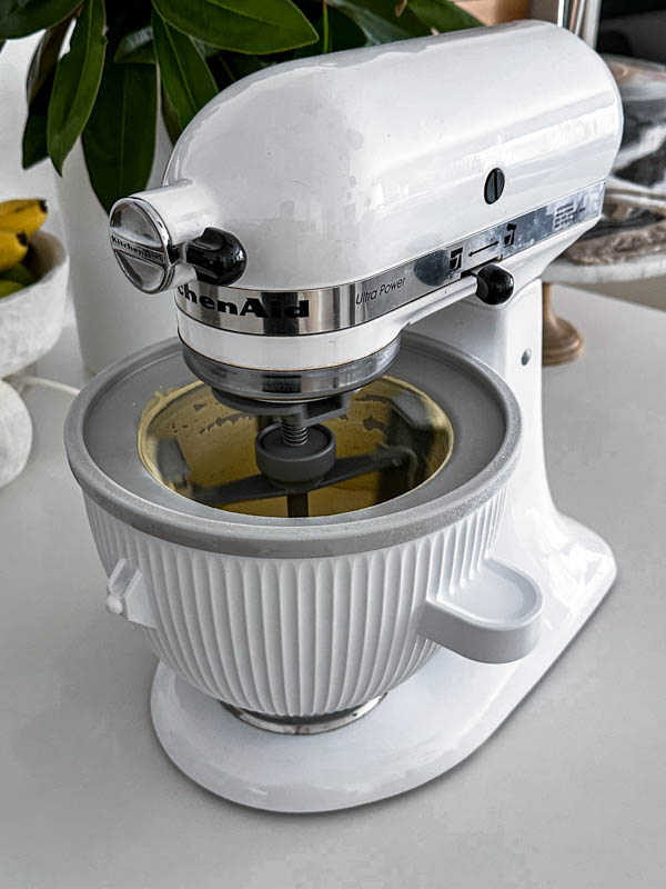 Here the custard is in the bowl of a KitchenAid Ice Cream Maker and is churning to form ice cream.
