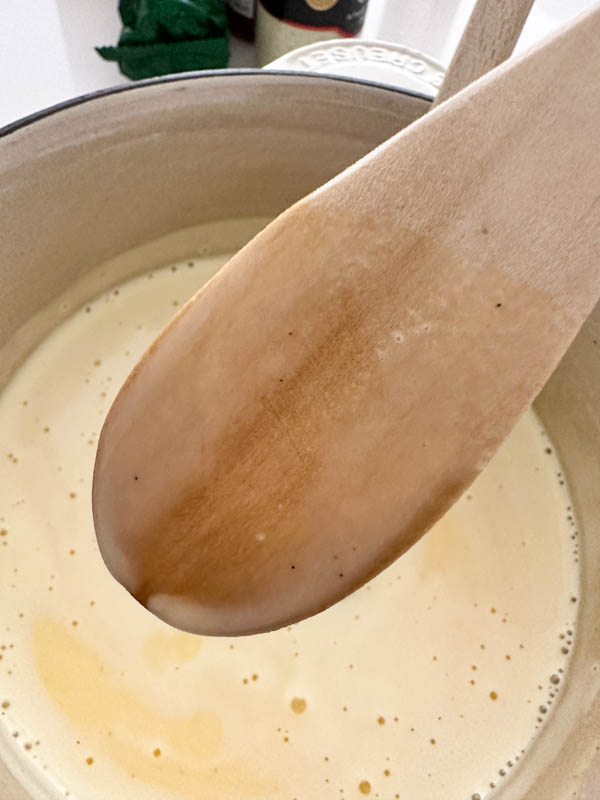 Another way to test whether the custard is ready is to coat the back of the spoon and run your finger through it. If it leaves a line, then the custard is ready.